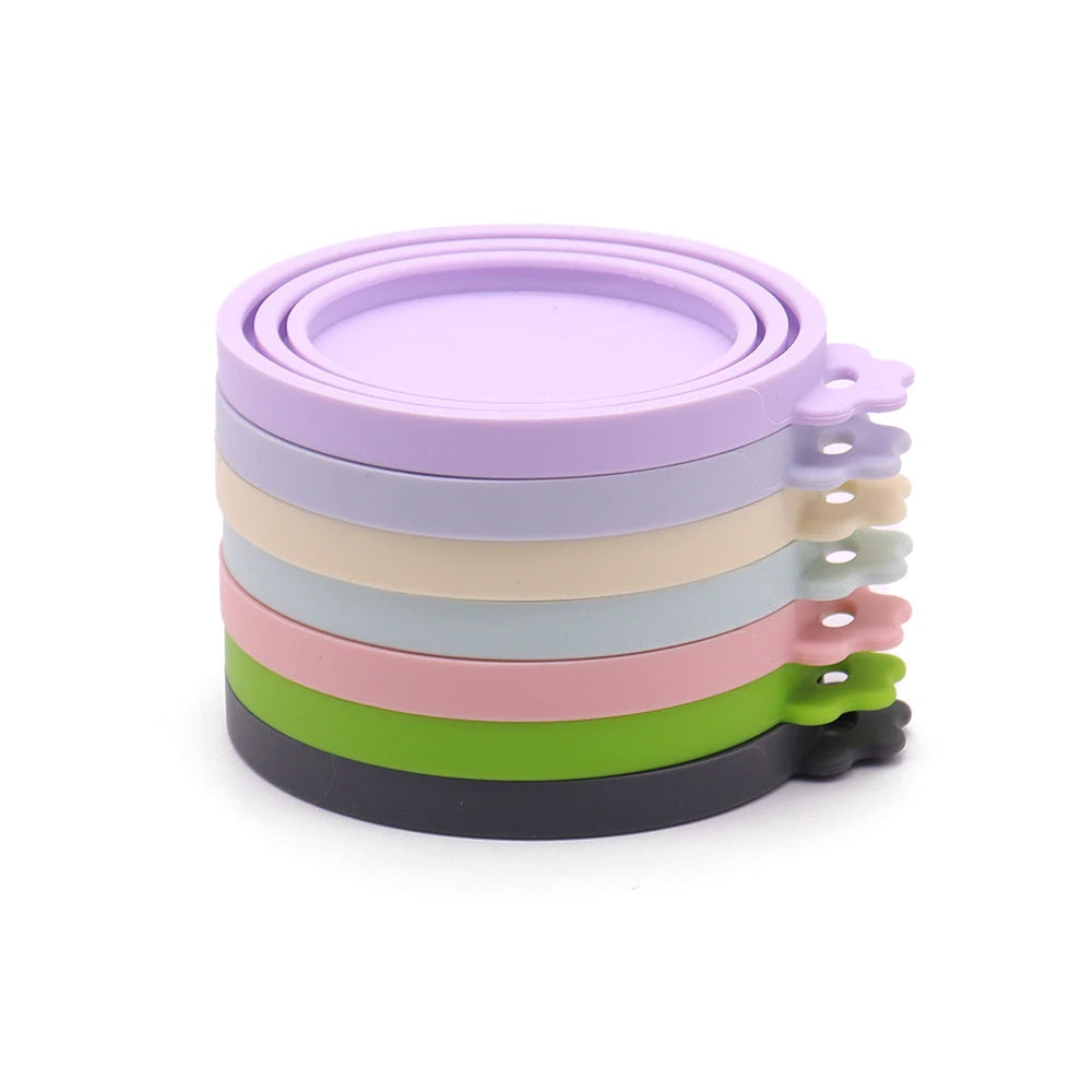 Stack of colorful silicone bands on a white background